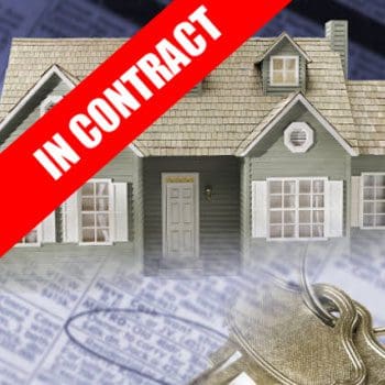 A house with keys and the words " in contract ".